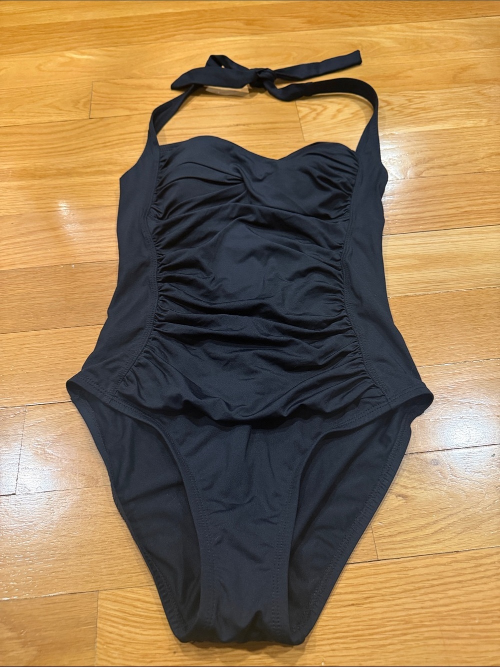 La Blanca black halter one piece swimsuit size 4 .